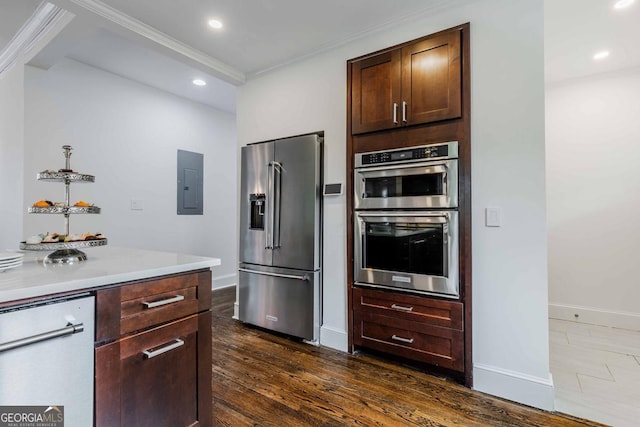 937 Rosedale Rd NE, Atlanta, GA 30306 - kitchen featuring appliances with stainless steel finishes, electric panel, light countertops, crown molding, and dark wood finished floors