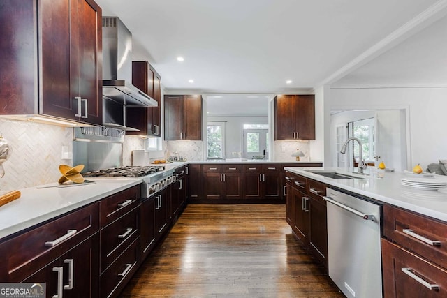 937 Rosedale Rd NE, Atlanta, GA 30306 - kitchen featuring appliances with stainless steel finishes, wall chimney range hood, dark wood finished floors, healthy amount of natural light, and recessed lighting