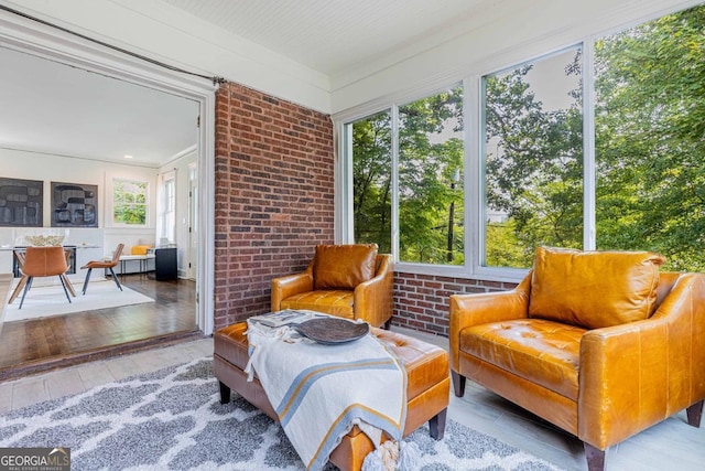 937 Rosedale Rd NE, Atlanta, GA 30306 - sunroom with brick wall and wood-type flooring