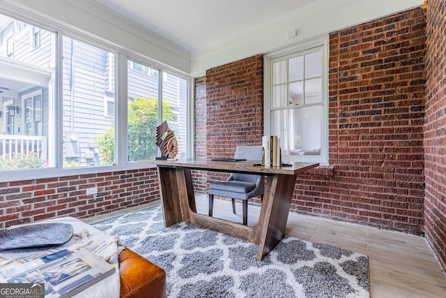 937 Rosedale Rd NE, Atlanta, GA 30306 - sunroom with brick wall and wood finished floors