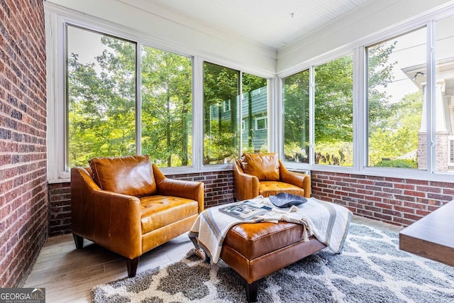 937 Rosedale Rd NE, Atlanta, GA 30306 - sunroom with brick wall and wood finished floors