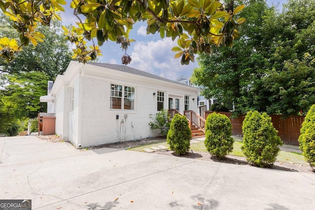 937 Rosedale Rd NE, Atlanta, GA 30306 - view of front of house featuring brick siding, a patio, and french doors