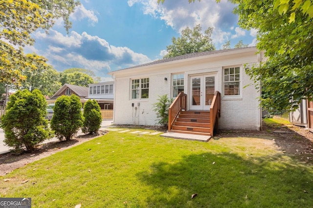 937 Rosedale Rd NE, Atlanta, GA 30306 - rear view of house with french doors, a yard, brick siding, and entry steps