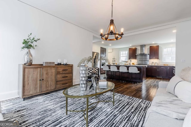 937 Rosedale Rd NE, Atlanta, GA 30306 - living area with a chandelier, dark wood-type flooring, crown molding, and recessed lighting