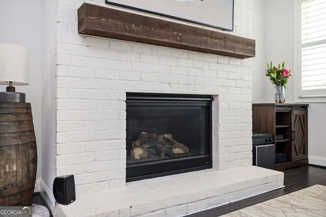 2026 Forte Ln, Alpharetta, GA 30009 - detailed view of baseboards, wood finished floors, and a fireplace