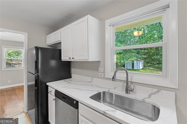 2358 Dabney Ter, East Point, GA 30344 - kitchen featuring dishwasher, a sink, white cabinets, and light stone countertops