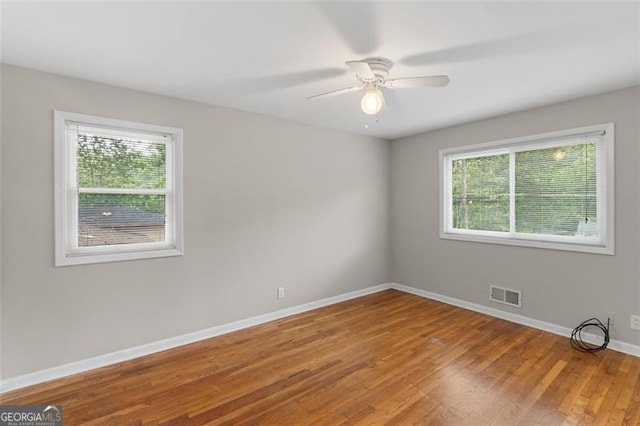 2358 Dabney Ter, East Point, GA 30344 - unfurnished room with baseboards, wood finished floors, and ceiling fan