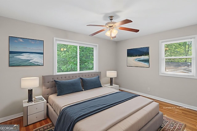 2358 Dabney Ter, East Point, GA 30344 - bedroom featuring baseboards, wood finished floors, and a ceiling fan