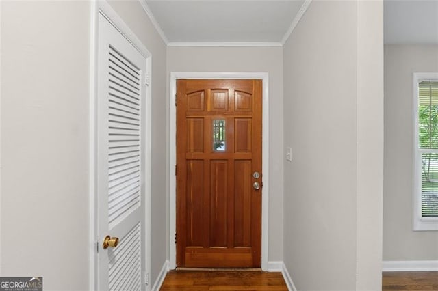 2358 Dabney Ter, East Point, GA 30344 - doorway featuring dark wood-style floors, baseboards, and ornamental molding
