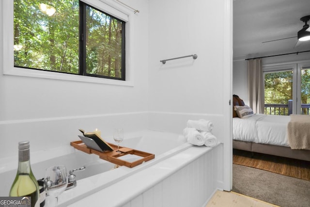 223 Mango Cir, Ellijay, GA 30540 - ensuite bathroom featuring a garden tub and wood finished floors