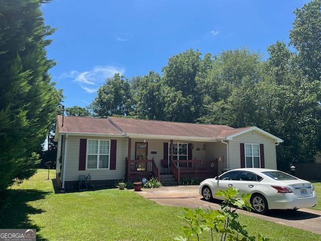 1216 Shady Ln, Thomaston, GA 30286 - view of front facade with a porch and a front yard