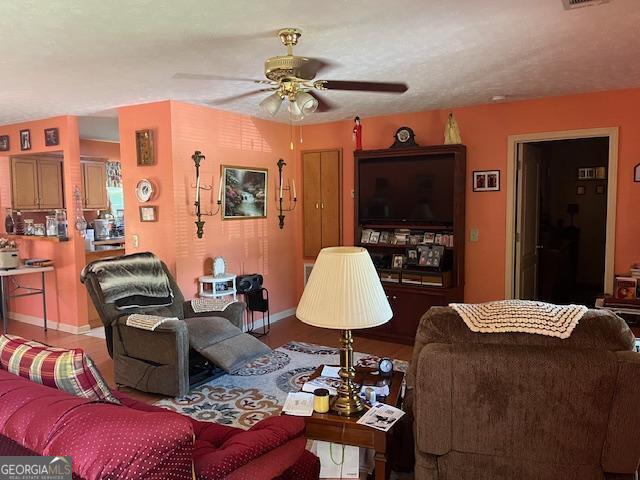 1216 Shady Ln, Thomaston, GA 30286 - living area with a ceiling fan and baseboards