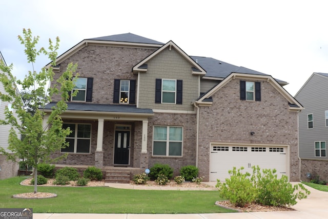150 Canal St, Hampton, GA 30228 - craftsman-style house with driveway, an attached garage, brick siding, and a front lawn