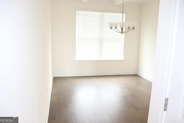 150 Canal St, Hampton, GA 30228 - spare room with a chandelier, wood finished floors, and baseboards