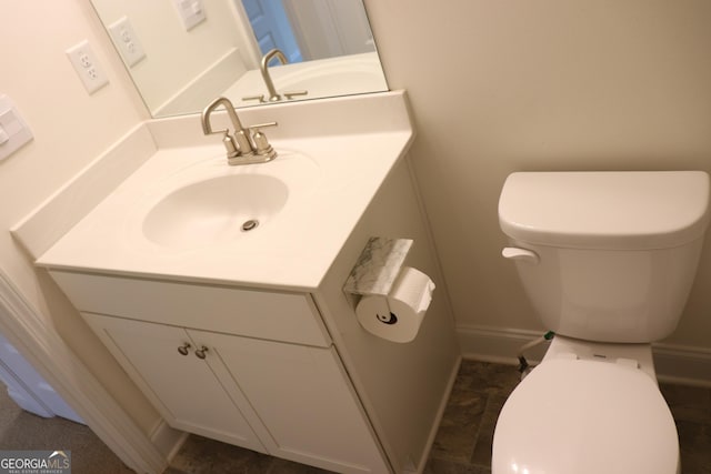 150 Canal St, Hampton, GA 30228 - half bathroom with vanity, toilet, and baseboards