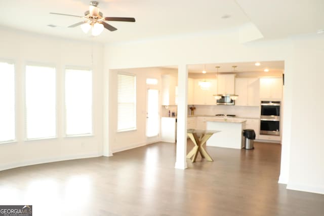 150 Canal St, Hampton, GA 30228 - living room with healthy amount of natural light, dark wood-type flooring, and ceiling fan