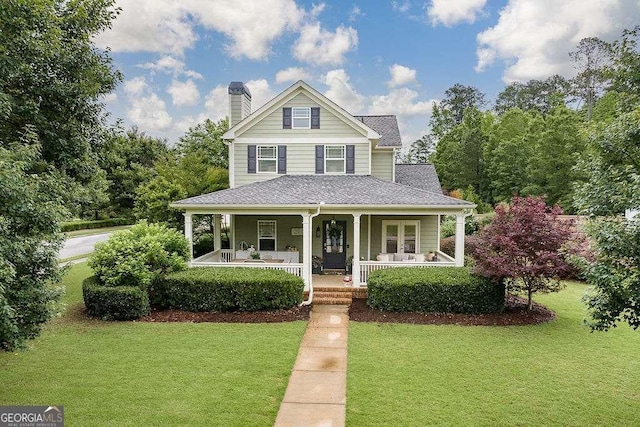 1901 Franklin Grove Pkwy, Bogart, GA 30622 - view of front of house featuring a chimney, a front lawn, and a porch