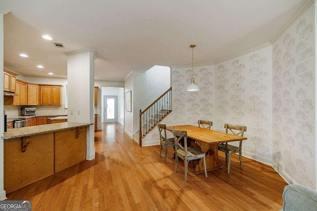 1901 Franklin Grove Pkwy, Bogart, GA 30622 - dining space with light wood finished floors, ornamental molding, stairway, recessed lighting, and wallpapered walls