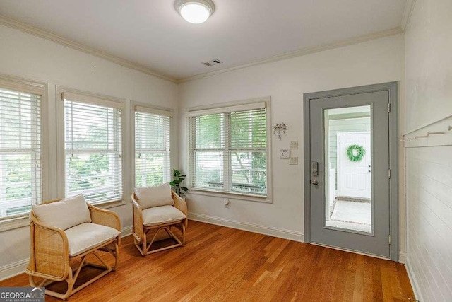 1901 Franklin Grove Pkwy, Bogart, GA 30622 - living area featuring plenty of natural light, light wood finished floors, ornamental molding, and baseboards