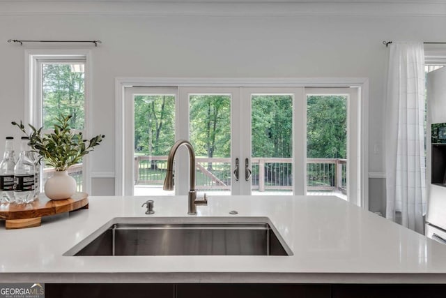 14440 Cogburn Rd, Alpharetta, GA 30004 - kitchen featuring a sink and light countertops