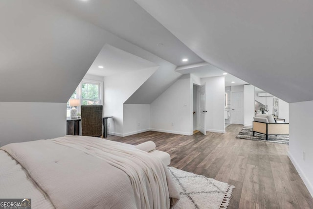 14440 Cogburn Rd, Alpharetta, GA 30004 - bedroom with wood finished floors, recessed lighting, vaulted ceiling, and baseboards