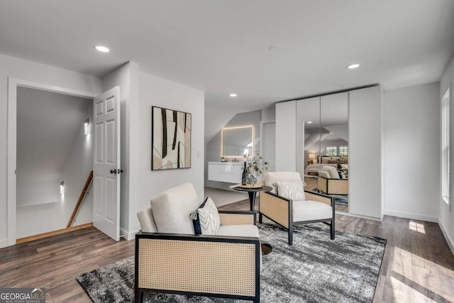 14440 Cogburn Rd, Alpharetta, GA 30004 - living area with an upstairs landing, wood finished floors, recessed lighting, and baseboards
