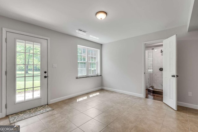 14440 Cogburn Rd, Alpharetta, GA 30004 - entryway with light tile patterned floors and baseboards