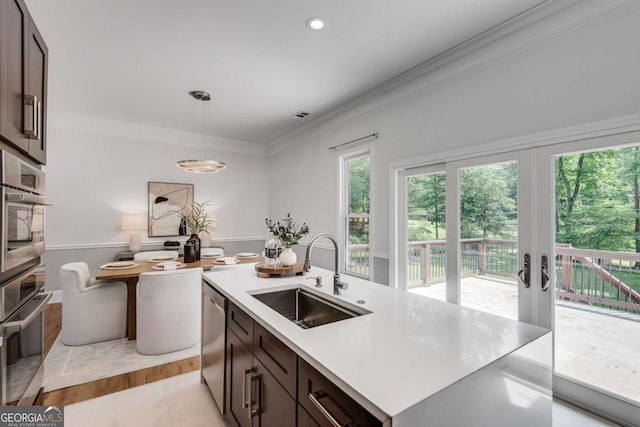 14440 Cogburn Rd, Alpharetta, GA 30004 - kitchen featuring a sink, dishwasher, crown molding, light countertops, and french doors