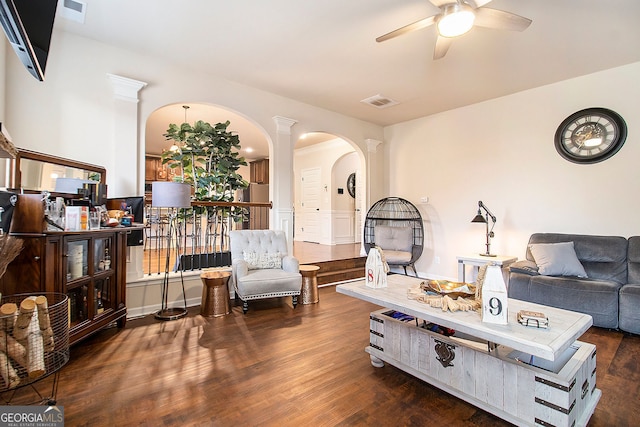 817 Nevis Way, Mcdonough, GA 30253 - living area with arched walkways, a ceiling fan, and wood finished floors