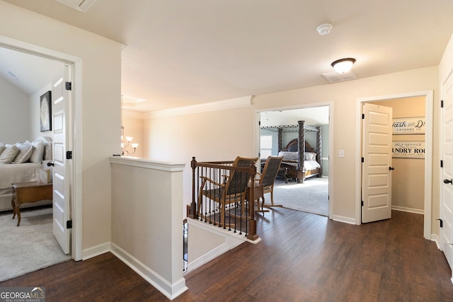 817 Nevis Way, Mcdonough, GA 30253 - hall featuring an upstairs landing, wood finished floors, baseboards, and crown molding