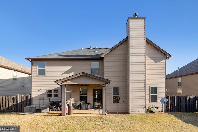 817 Nevis Way, Mcdonough, GA 30253 - rear view of house featuring a patio area, a ceiling fan, a chimney, and cooling unit