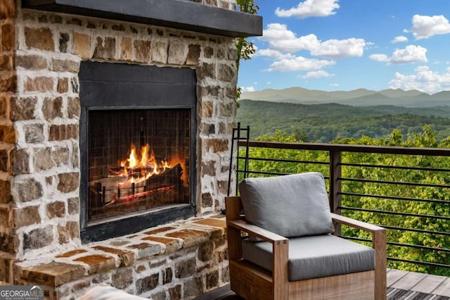 719 Ripshin Mountain Rd, Blue Ridge, GA 30513 - balcony with an outdoor stone fireplace and a mountain view