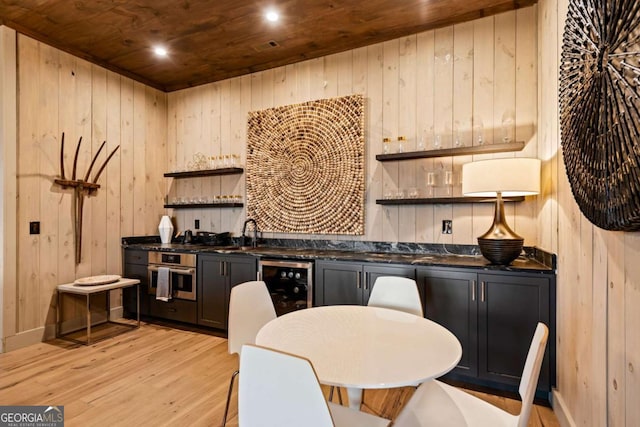 719 Ripshin Mountain Rd, Blue Ridge, GA 30513 - kitchen featuring open shelves, wooden ceiling, wooden walls, light wood-style floors, and beverage cooler