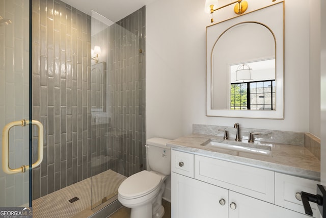 555 Orme Cir NE, Atlanta, GA 30306 - bathroom with toilet, vanity, and a shower stall