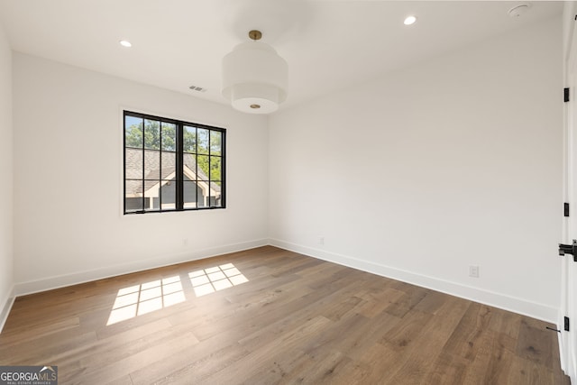 555 Orme Cir NE, Atlanta, GA 30306 - empty room featuring wood finished floors, baseboards, and recessed lighting