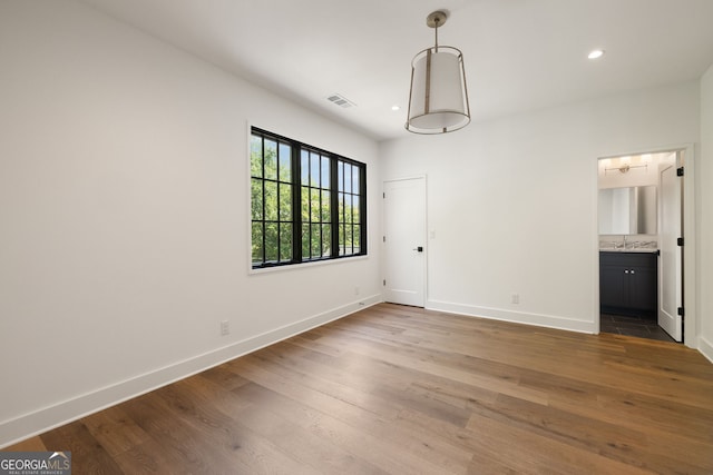 555 Orme Cir NE, Atlanta, GA 30306 - empty room featuring baseboards, a sink, wood finished floors, and recessed lighting
