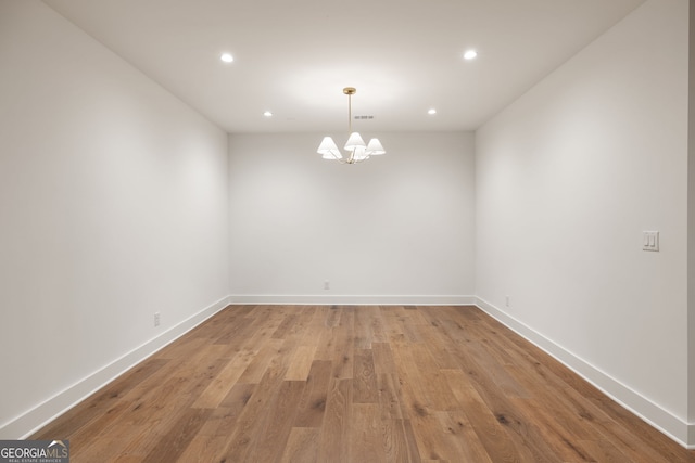555 Orme Cir NE, Atlanta, GA 30306 - empty room featuring a chandelier, recessed lighting, light wood-style flooring, and baseboards