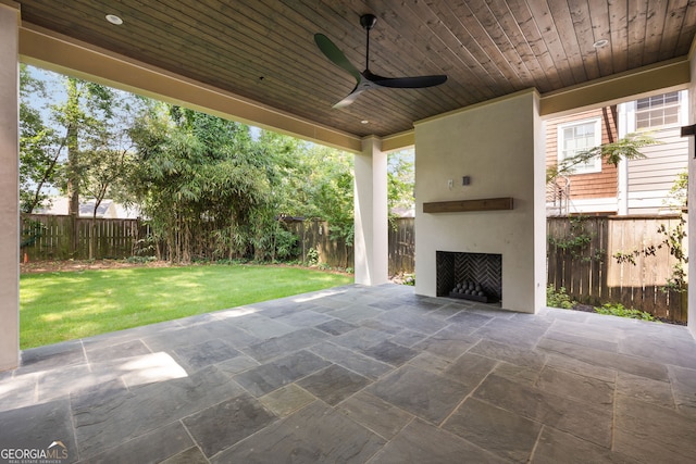 555 Orme Cir NE, Atlanta, GA 30306 - view of patio / terrace featuring exterior fireplace and ceiling fan