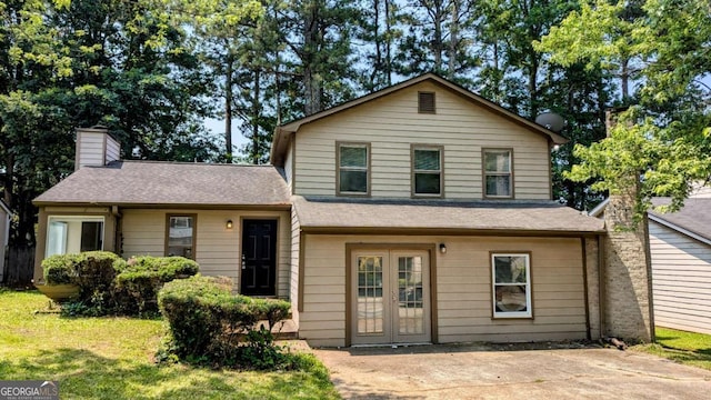 2015 Corners Cir, Lithonia, GA 30058 - view of front of property featuring a chimney, roof with shingles, and a front lawn