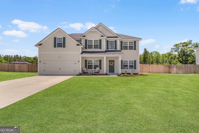 26 NE Sunflower Cir, Ludowici, GA 31316 - view of front of property with concrete driveway, an attached garage, a porch, and board and batten siding