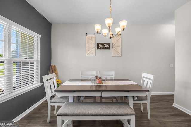 26 NE Sunflower Cir, Ludowici, GA 31316 - dining area featuring wood finished floors, a chandelier, and baseboards