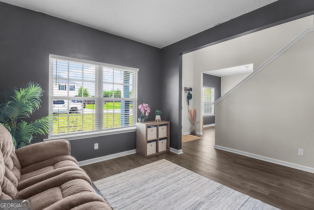 26 NE Sunflower Cir, Ludowici, GA 31316 - living area with dark wood-type flooring and baseboards