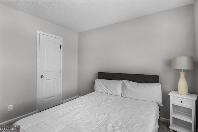 26 NE Sunflower Cir, Ludowici, GA 31316 - bedroom featuring baseboards and a textured ceiling