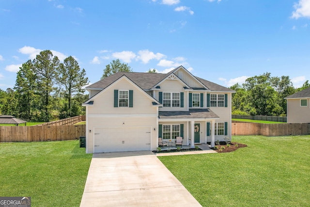26 NE Sunflower Cir, Ludowici, GA 31316 - view of front of property with driveway, an attached garage, covered porch, and roof with shingles