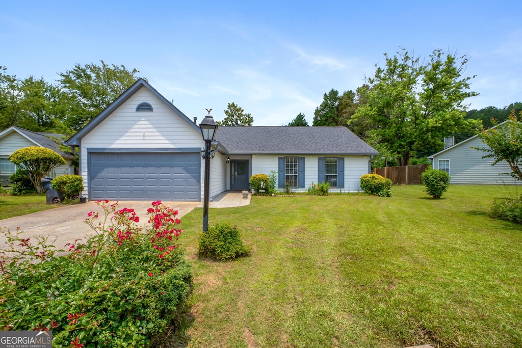 1055 Kibbe Cir, Lawrenceville, GA 30044 - ranch-style house with concrete driveway and an attached garage