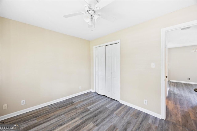 437 Edgewater Cir, Macon, GA 31220 - unfurnished bedroom with dark wood-style flooring, a closet, and baseboards
