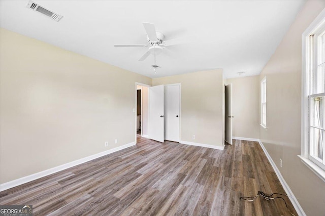 437 Edgewater Cir, Macon, GA 31220 - unfurnished bedroom featuring wood finished floors, baseboards, and a ceiling fan