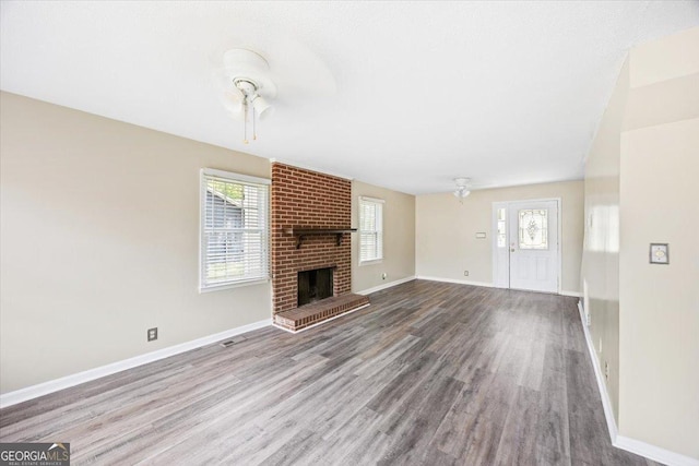 437 Edgewater Cir, Macon, GA 31220 - unfurnished living room featuring plenty of natural light, baseboards, and wood finished floors