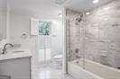 2769 Peachtree Rd NE Unit 10, Atlanta, GA 30305 - bathroom with a stall shower and double vanity