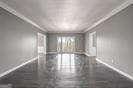 2769 Peachtree Rd NE Unit 10, Atlanta, GA 30305 - empty room featuring baseboards and finished concrete floors